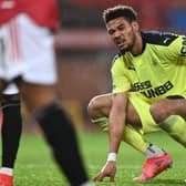 Joelinton in pain at Old Trafford.