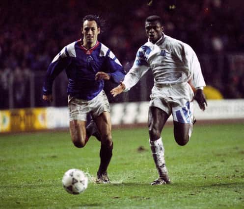 Rangers drew with Marseille in November 1992 at Ibrox before the away group stage fixture in the south of France in April 1993
Rangers striker Mark Hateley (left) goes for the ball with Marcel Desailly in the Ibrox encounter.
