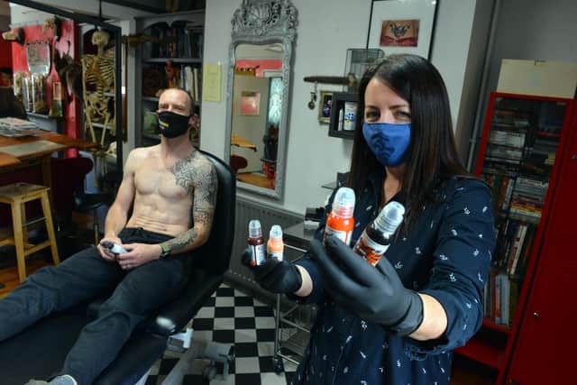 Elixir Tattoo owner artist Mel Blyth reopened at midnight to complete work on client Kris Armstrong following lockdown.