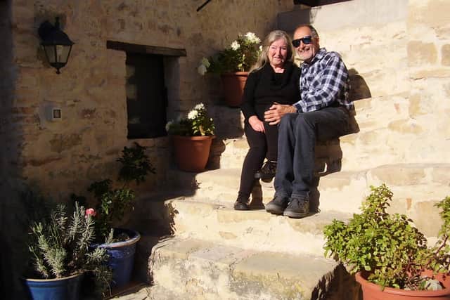 Greg and Sandra outside their home in Italy.