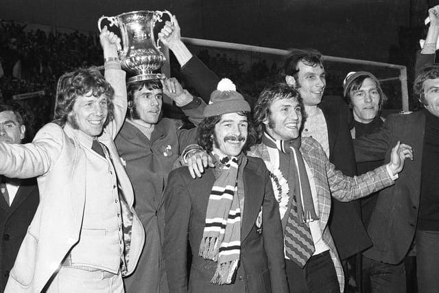 The homecoming reaches Roker Park and here are Jimmy Montgomery, Bobby Kerr, Dennis Tueart,  Dave Watson, Dick Malone, David Young and Ron Guthrie with the trophy.