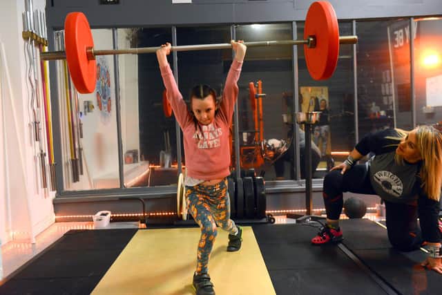Olympic weightlifting athlete and coach Zoe Chandler with granddaughter Libby Warwick-Snow, 10, as she puts her through a training programme.
