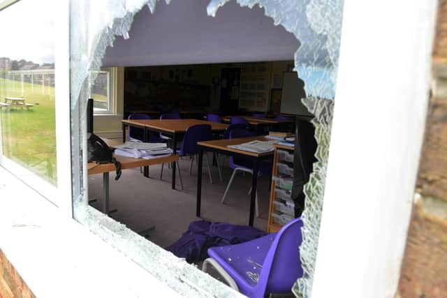 Vandals smashed windows during their attack on the school.