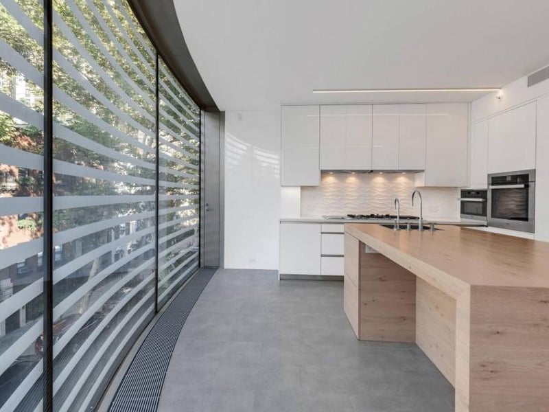 The bulletproof structural glass façade is the building’s most distinctive feature.