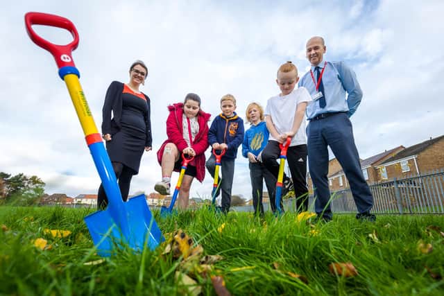 Year 3 pupils from Albany Village Primary School get ready to plant Basket Willow trees to offset carbon emissions and improve sustainability. (Left to right) Sunderland City Council's Low Carbon Officer Natalie Watson, Olivia Smith, 8, Charlie Hitcham, 7, Jonathan Stimpson, 7, William Garrett, 8, and Headteacher Stephen Jones.

Photograph: Elliot Nichol