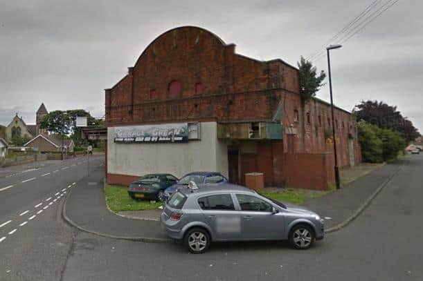The former cinema in 2016 when it was being used to store cars. Google maps.