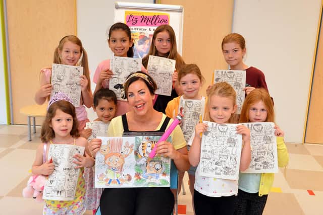 Author and illustrator Liz Million with children taking part in a workshop at Sunderland City Library.