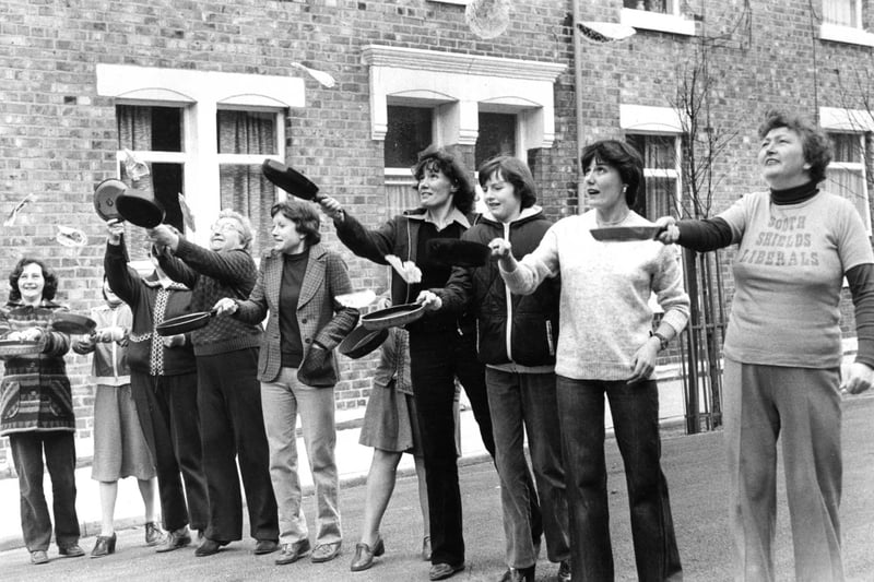 Practising pancake flips before the annual race organised by Hyde Street Venture Group in 1980. Who do you recognise in this photo?