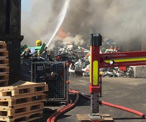 Huge plumes of smoke can be seen for miles as firefighters tackle blaze