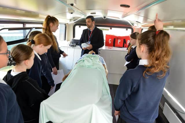 Hetton Lyons Primary School children with the life-size simulator patient dummy.