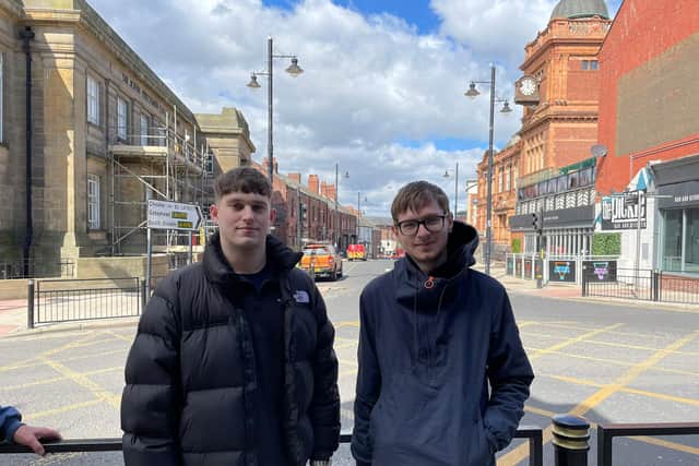 Sam Anderson (left), 21 and Dom Zvirblys, 22 who were waiting in the queue for the Cooper Rose pub on the day of reopening