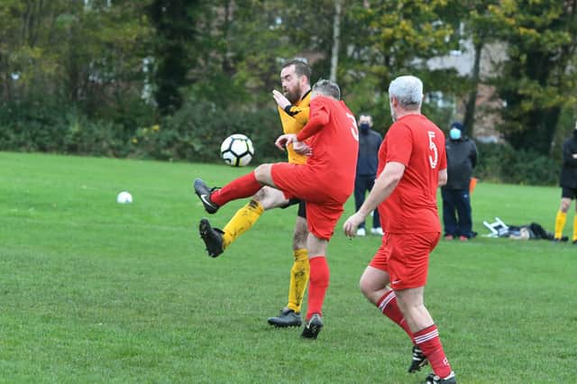 Ivy Legends Over-40s (yellow) in action against Seaton Buildings