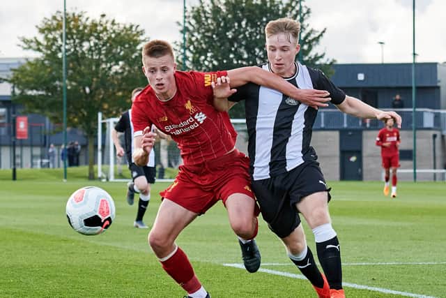 Niall Brookwell takes on Newcastle's Tom Midgely during an U18 Premier League game. Brookwell has joined Newcastle from Liverpool.