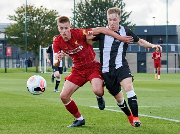 Niall Brookwell takes on Newcastle's Tom Midgely during an U18 Premier League game. Brookwell has joined Newcastle from Liverpool.