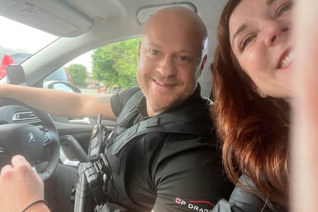 PC Andy Jackson with Denise after he saved her and Alyssa from the side of the road.