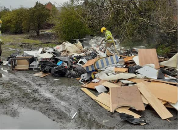 Crews dampened a huge pile of fly-tipped rubbish in Shotton Colliery.