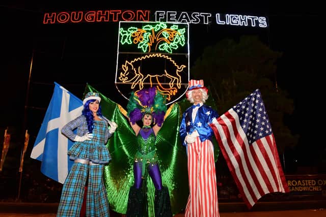 Stilt walkers at The Houghton Feast 2021 opening ceremony on The Broadway.