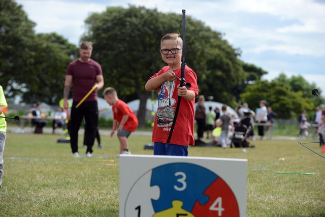 Oliver Butler, seven, takes aim during his first ever chance to try archery.