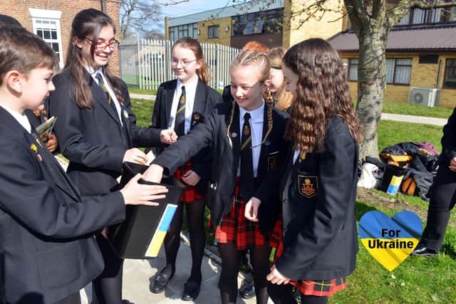 Southmoor Academy pupils donating to the school's Peace in Ukraine campaign.