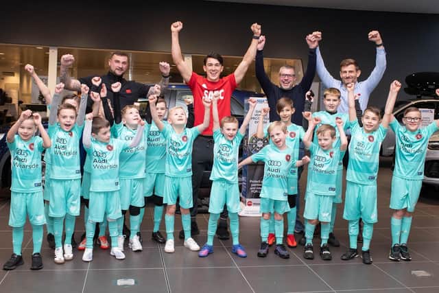 Dan Madden (North East Elite Football Club U10s coach), Luke O’Nien, Richard Hyde (Lookers Wearside Audi Head of Business) and Michael Scott (Lookers Audi Franchise Director) with members of North East Elite Football Club under-7 and under-10 teams. Photo:The Bigger Picture Agency Ltd.