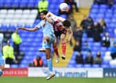 Luke O'Nien competes for the ball against Coventry City.