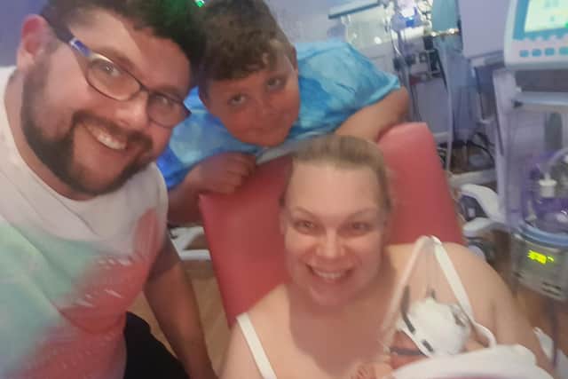 Parents Adele and Jonathan Smith with  their daughter Charlotte in hospital.