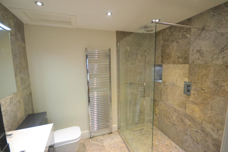 Stylish and well-presented ensuite incorporating a large walk in shower with glass screen.