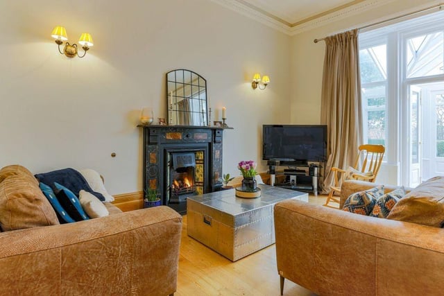 The family room features a fireplace and living flame gas fire.