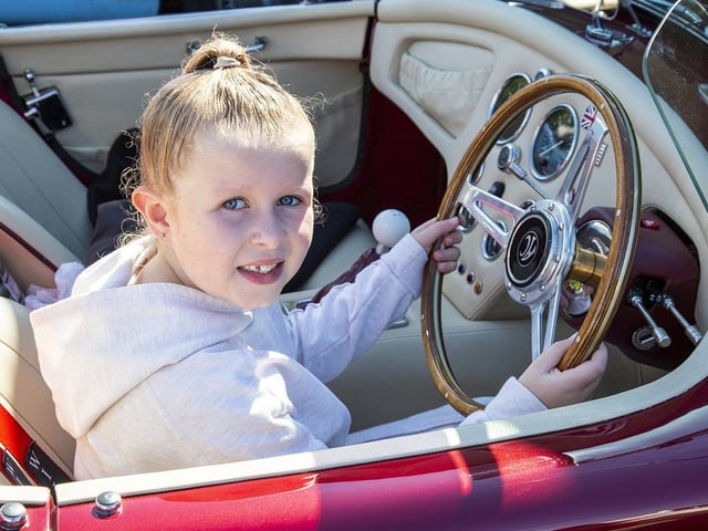 Skye Bolden enjoys a ride in a Replica AC Cobra.