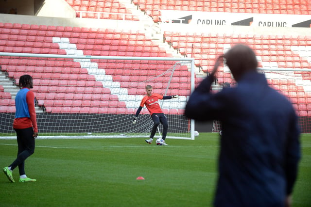 Sunderland goalkeeper Alex Bass practising his passing out from the back.