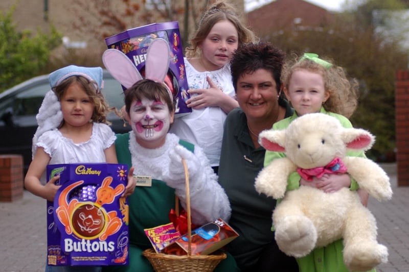 Who can tell us more about this 2003 scene showing staff from Asda and children with Easter bunnies and eggs?