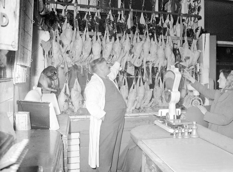 Choosing the Christmas turkey at Tommy Rowntrees in December 1956. Photo: Bill Hawkins.
