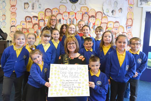 Retiring Seaview Primary School headteacher, Karen Field, surrounded by some of the children she has nurtured during 14 years at the school.