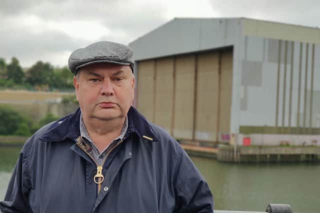 March organiser Brian Moore standing in front of Pallion Shipyard.
