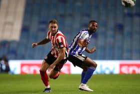 Sunderland's Jack Diamond (left) and Sheffield Wednesday's Michael Ihiekwe battle for the ball. PA picture.