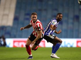 Sunderland's Jack Diamond (left) and Sheffield Wednesday's Michael Ihiekwe battle for the ball. PA picture.