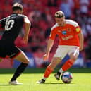 Blackpool's Elliot Embleton (right) and Lincoln City's Jorge Grant battle for the ball during the Sky Bet League One playoff final match held at Wembley Stadium, London. Picture date: Sunday May 30, 2021.