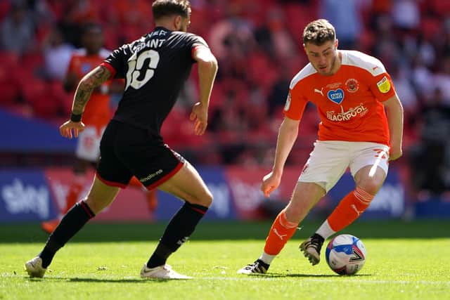 Blackpool's Elliot Embleton (right) and Lincoln City's Jorge Grant battle for the ball during the Sky Bet League One playoff final match held at Wembley Stadium, London. Picture date: Sunday May 30, 2021.