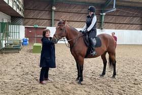 Brenda meeting 16-year-old horse rider Talitha Green who is riding Bradley the horse at Washington Riding Centre.