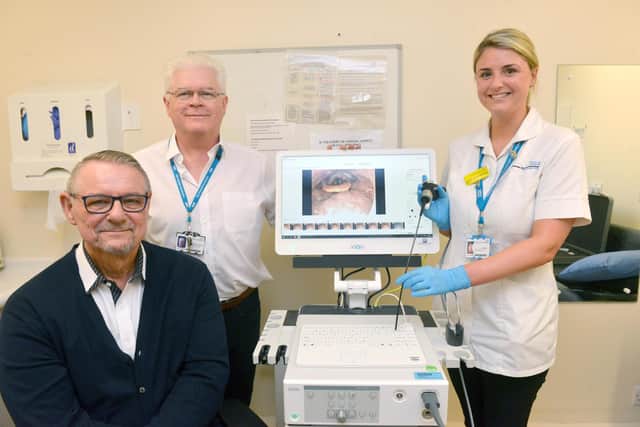 Brian Henderson unveils the new endoscope that he has fundraised for Sunderland Royal Hospital with head and neck consultant Frank Stafford and speech and language therapist Laura-Jayne Watson