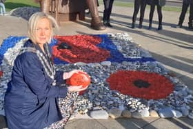 Mayor Leanne Kennedy lays the final stone