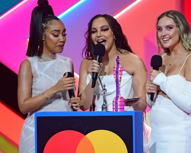 Little Mix members Leigh-Anne Pinnock (left), Jade Thirlwall (middle) and Perrie Edwards (right) at the Brit Awards. Photo: PA.