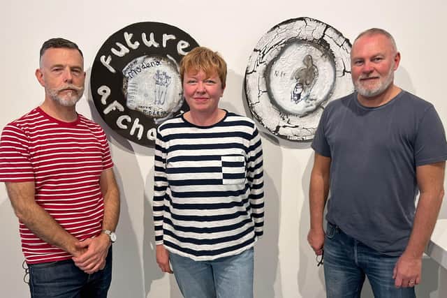 From left to right, curator Gregory Parsons, artists Andrea Walsh and Andrew Livingstone in front of some of Andrew's work
