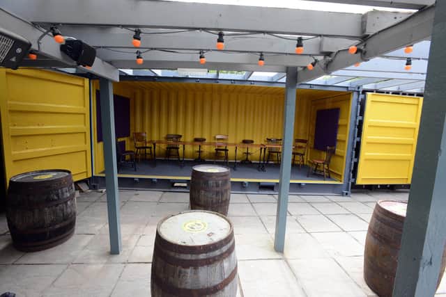The Anchor is a partially covered outdoor space at the bar