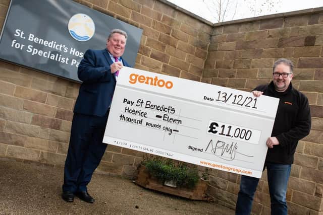 Nigel Wilson of Gentoo presents St Benedict's Hospice with their share of £22,000 raised by Gentoo workers.