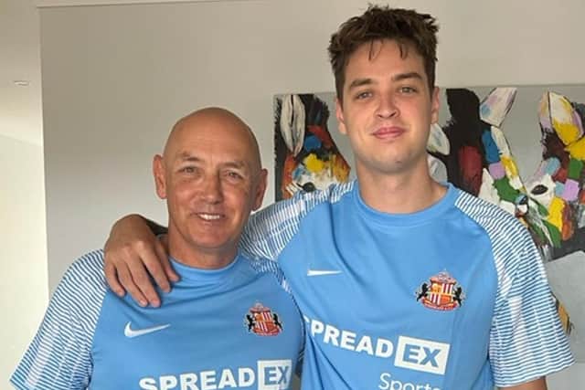 Marc with his son Tom, 21, in their Sunderland shirts on Christmas Day last year.