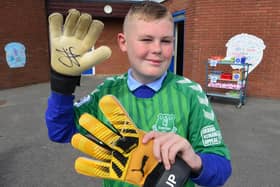 Joe Ingram with a pair of gloves and a shirt donated by Jordan Pickford to be raffled.

 Picture by FRANk REID