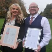 George Washington Hotel marketing manager Sandra Devlin and manager Ian Gray and with the venue's new Armed Forces Covenant Silver award.