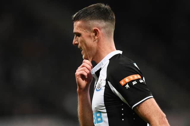 NEWCASTLE UPON TYNE, ENGLAND - NOVEMBER 30: Ciaran Clark of Newcastle United makes his way towards the tunnel after being shown a red card during the Premier League match between Newcastle United and Norwich City at St. James Park on November 30, 2021 in Newcastle upon Tyne, England. (Photo by Stu Forster/Getty Images)