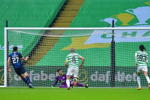 Ross Stewart of Ross County scores their team's first goal from the penalty spot during the Betfred Cup match between Celtic and Ross County at Celtic Park.